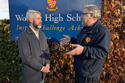 Will Forster speaking to Woking High School Caretaker