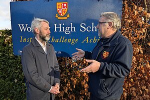 Will Forster speaking to Woking High School Caretaker